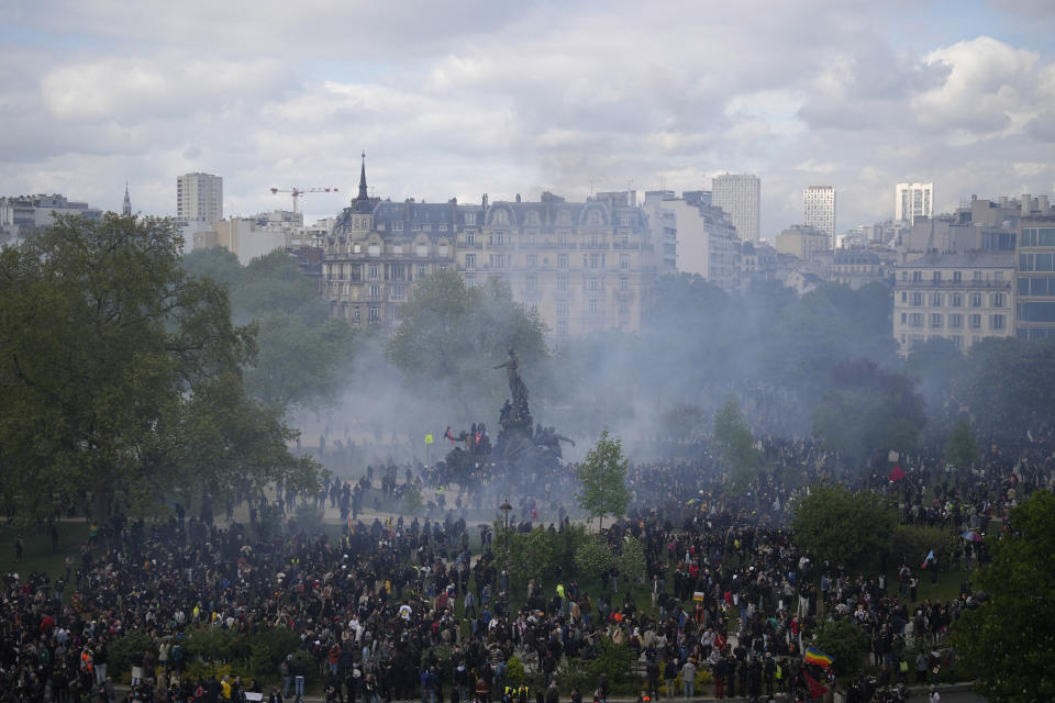 Protesters arrive Place de la Nation during a demonstration, Monday, May 1, 2023 in Paris. Across France, thousands marched in what unions hope are the country's biggest May Day demonstrations in years, mobilized against President Emmanuel Macron's recent move to raise the retirement age from 62 to 64. (AP Photo/Thibault Camus)