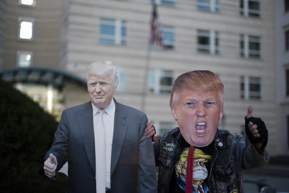 Gerd Lindner, as he said a huge fan of US President Donald Trump, poses near a paper mache effigy of Donald Trump with a Trump mask to support the President a day after the election, in the front of the United States embassy in Berlin, Germany, Wednesday, Nov. 4, 2020. (Photo/Markus Schreiber)