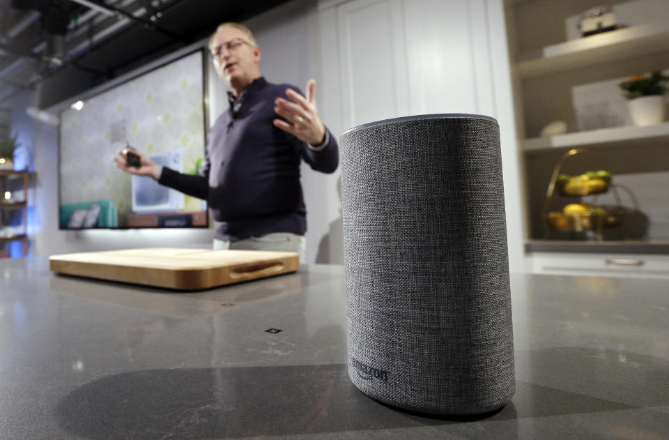 A new Amazon Echo is displayed during a program announcing several new Amazon products by the company, Wednesday, Sept. 27, 2017, in Seattle. Amazon says it is cutting the price of its Echo smart speaker to $100 from $180, improving the sound quality and upgrading its appearance with six new "shells." The next generation speaker, which is powered by Amazon's Alexa voice assistant, will have a dedicated woofer and a tweeter for the first time, as well as Dolby sound. (AP Photo/Elaine Thompson)