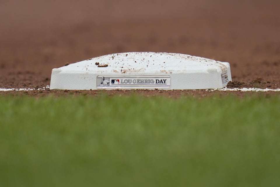 A base has a plaque honoring Lou Gehrig Day during the third inning of a baseball game between the Baltimore Orioles and the Seattle Mariners, Thursday, June 2, 2022, in Baltimore. (AP Photo/Julio Cortez)