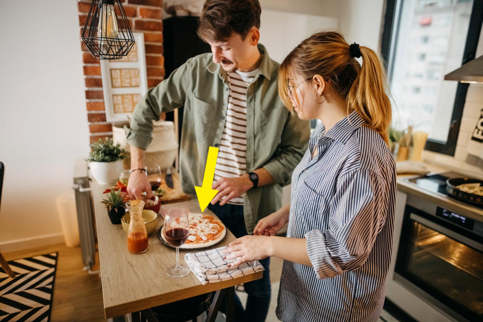 Young couple after just baking a pizza together