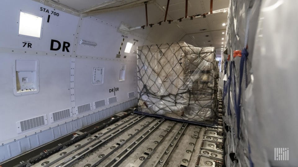 A large air cargo pallet gets moved into place on a Boeing 747-8 freighter. (Photo: Jim Allen/FreightWaves)