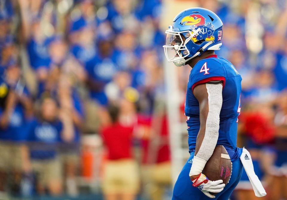 Kansas running back Devin Neal (4) celebrates after scoring a touchdown against Tennessee Tech last Friday.