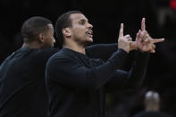 Boston Celtics coach Joe Mazzulla calls to players during the first half of Game 5 of the team's NBA basketball second-round playoff series against the Cleveland Cavaliers, Wednesday, May 15, 2024, in Boston. (AP Photo/Charles Krupa)