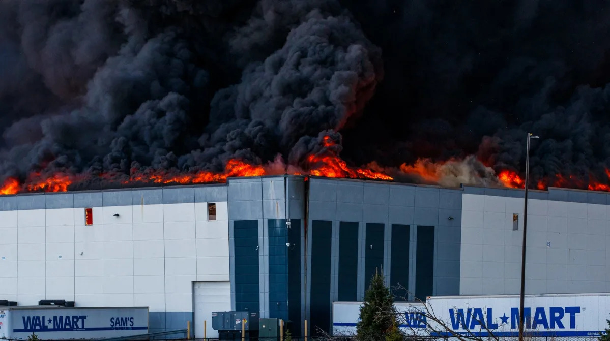 Billowing black smoke seen for miles as massive Walmart distribution center burn..