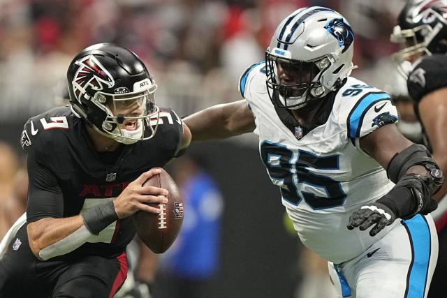 Robinson outshines top pick Young, Falcons beat Panthers