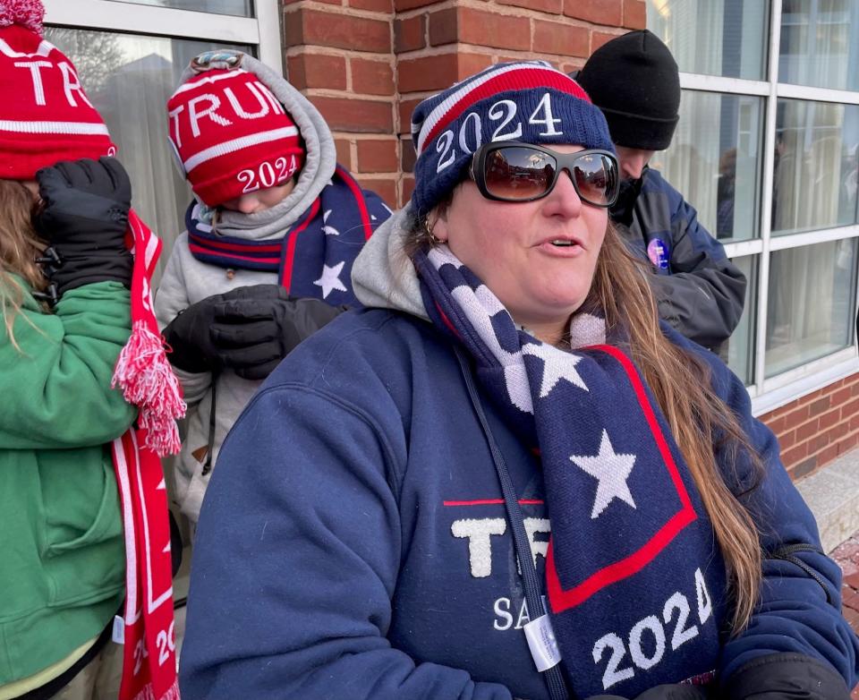 Sherry Carignan of Derry waits outside in Portsmouth to see former president Donald Trump Wednesday, Jan. 17, 2024.