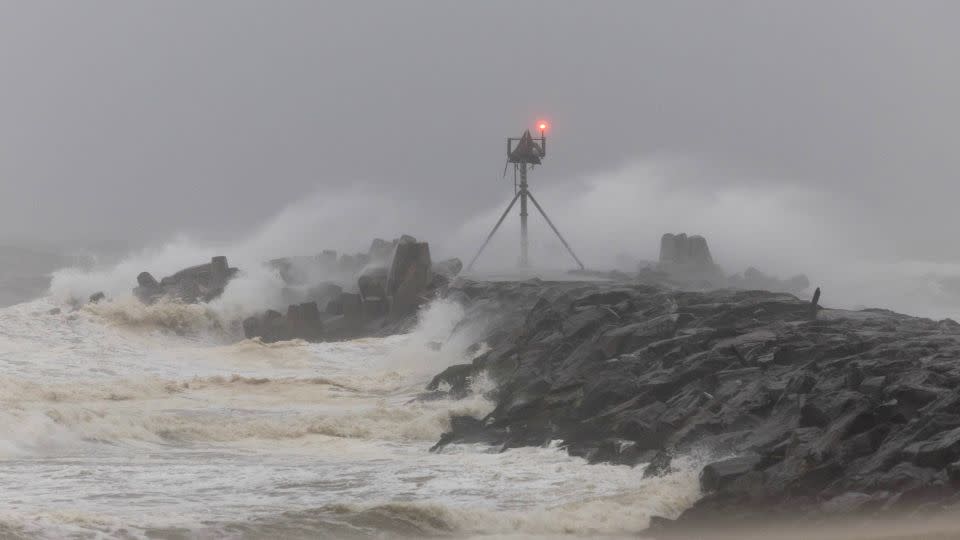 Waves shoot over a jetty at the Manasquan Inlet as Tropical Storm Ophelia impacts the Jersey Shore on Saturday. - Peter Ackerman/USA Today Network