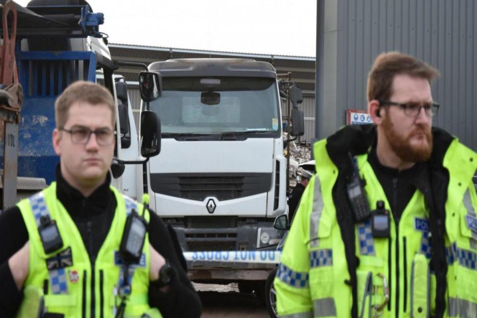 Police officers guard the scene after Mrs Smith's death <i>(Image: The Press)</i>