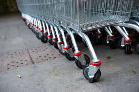 many empty shopping carts in a...