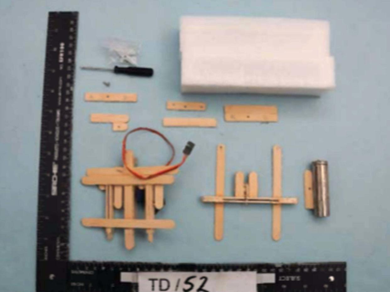 A construction made of lollipop sticks that experts found was a "viable" attachment to drop explosives from a drone: Greater Manchester Police
