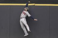 Atlanta Braves' Ender Inciarte fails to catch a two-run home run hit by Milwaukee Brewers' Avisail Garcia during the fifth inning of a baseball game Sunday, May 16, 2021, in Milwaukee. (AP Photo/Morry Gash)