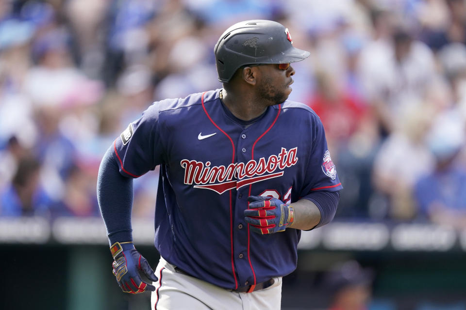 Minnesota Twins' Miguel Sano watches his two-run home run as he runs the bases during the sixth inning of a baseball game against the Kansas City Royals Saturday, June 5, 2021, in Kansas City, Mo. (AP Photo/Charlie Riedel)