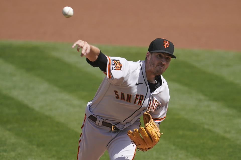 San Francisco Giants' Kevin Gausman pitches against the Oakland Athletics during the first inning of a baseball game in Oakland, Calif., Saturday, Sept. 19, 2020. (AP Photo/Jeff Chiu)