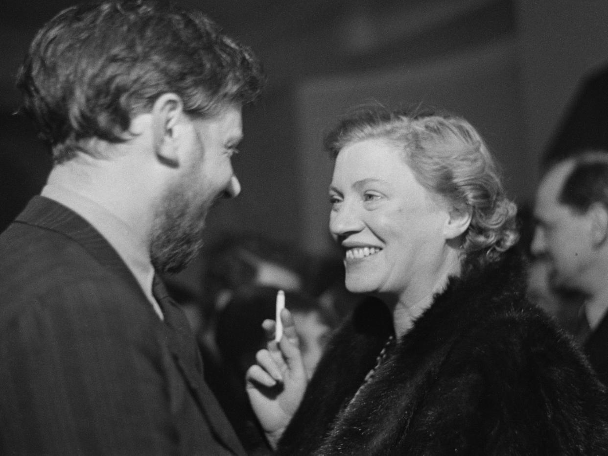 English art and radio critic Frederick Laws (left) and American photographer Lee Miller (1907 - 1977) attend a one-night performance of Pablo Picasso's play 'Desire Caught By The Tail' at the Rudolf Steiner Hall in London, March 1950. The production was presented by the Institute of Contemporary Arts (ICA) along with William Blake's 'An Island in the Moon'. Original Publication : Picture Post - 4988 - Pablo Picasso Playwright - Desire Caught By The Tail - pub. 4th March 1950 (Photo by Haywood Magee/Picture Post/Hulton Archive/Getty Images)