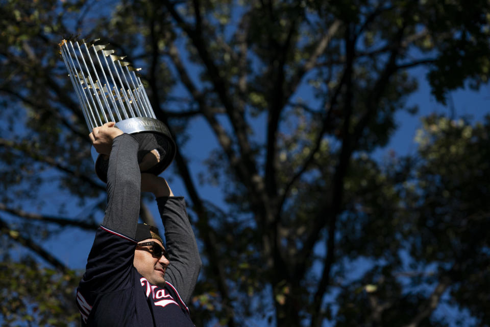 Ryan Zimmerman #11 of the Washington Nationals holds up the Commissioner's Trophy during a parade to celebrate the Washington Nationals World Series victory over the Houston Astros on November 2, 2019 in Washington, DC. This is the first World Series win for the Nationals in 95 years. / Credit: Patrick McDermott / Getty Images