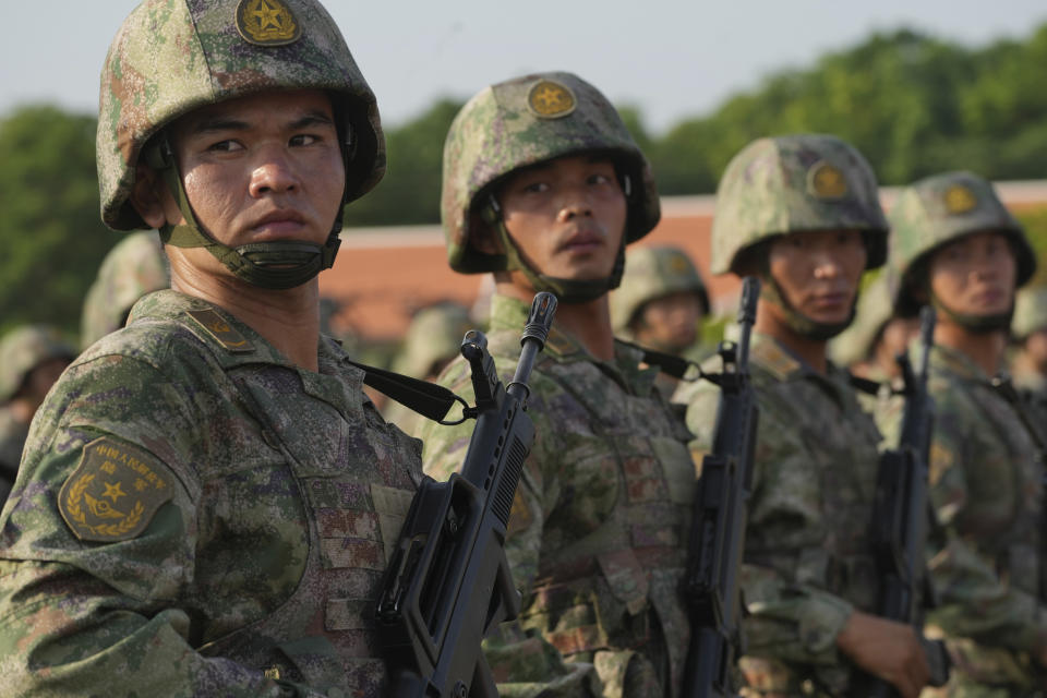 Chinese military personnel line up during the Golden Dragon military exercise in Svay Chok village, Kampong Chhnang province, north of Phnom Penh Cambodia, Thursday, May 16, 2024. Cambodia and China on Thursday kicked off their annual Golden Dragon military exercise to strengthen cooperation and exchange military experiences. (AP Photo/Heng Sinith)