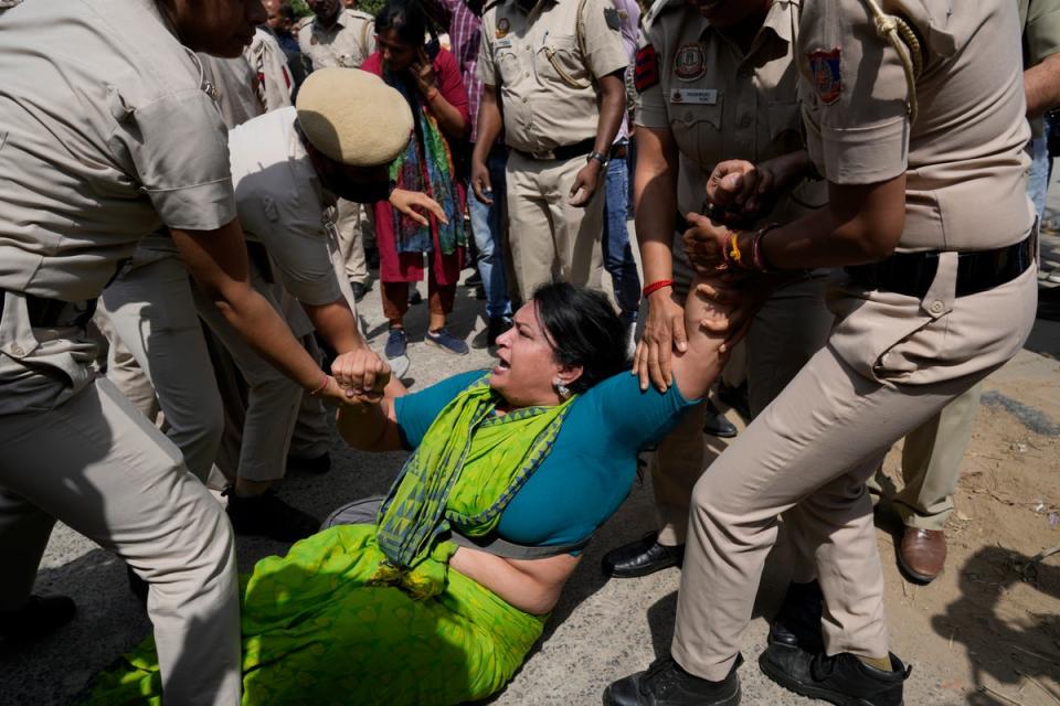Policemen detain a member of Aam Admi Party, or Common Man's Party, during a protest against the arrest of their party leader Arvind Kejriwal in New Delhi, India, Tuesday, 26 March 2024. (AP)