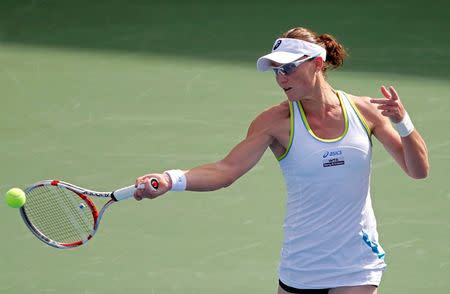 FILE PHOTO: Sam Stosur of Australia hits a return to Jelena Jankovic of Serbia during their women's singles quarter-final match at the WTA Dubai Tennis Championships February 23, 2012. REUTERS/Jumana El Heloueh