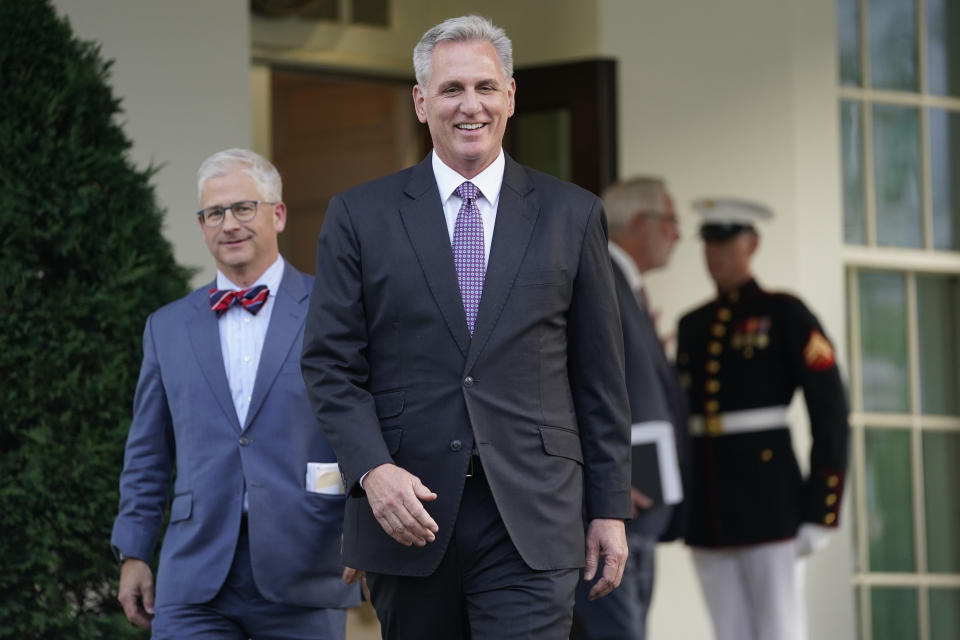 FILE - Speaker of the House Kevin McCarthy of Calif., and Rep. Patrick McHenry, R-N.C., walk to talk with reporters after meeting with President Joe Biden at the White House, Monday, May 22, 2023, in Washington. Biden and McCarthy came to an “agreement in principle” on the debt limit Saturday, May 27 that would avert a potentially disastrous U.S. default, but still has to pass both houses of Congress. (AP Photo/Evan Vucci, File)