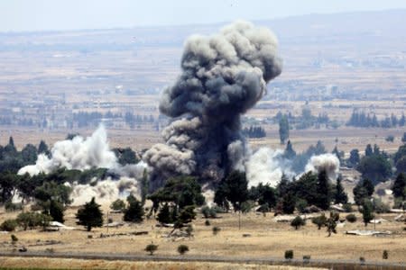 An explosion is pictured at Quneitra at the Syrian side of the Israeli Syrian border, as seen from the Israeli-occupied Golan Heights, Israel July 22, 2018. REUTERS/Ronen Zvulun