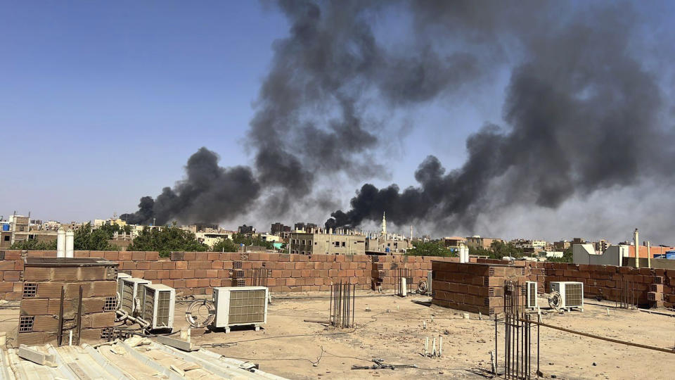In this photo provided by Maheen S , smoke fills the sky in Khartoum, Sudan, near Doha International Hospital on Friday, April 21, 2023. The Muslim Eid al-Fitr holiday, typically filled with prayer, celebration and feasting — was a somber one in Sudan, as gunshots rang out across the capital of Khartoum and heavy smoke billowed over the skyline. (Maheen S via AP)