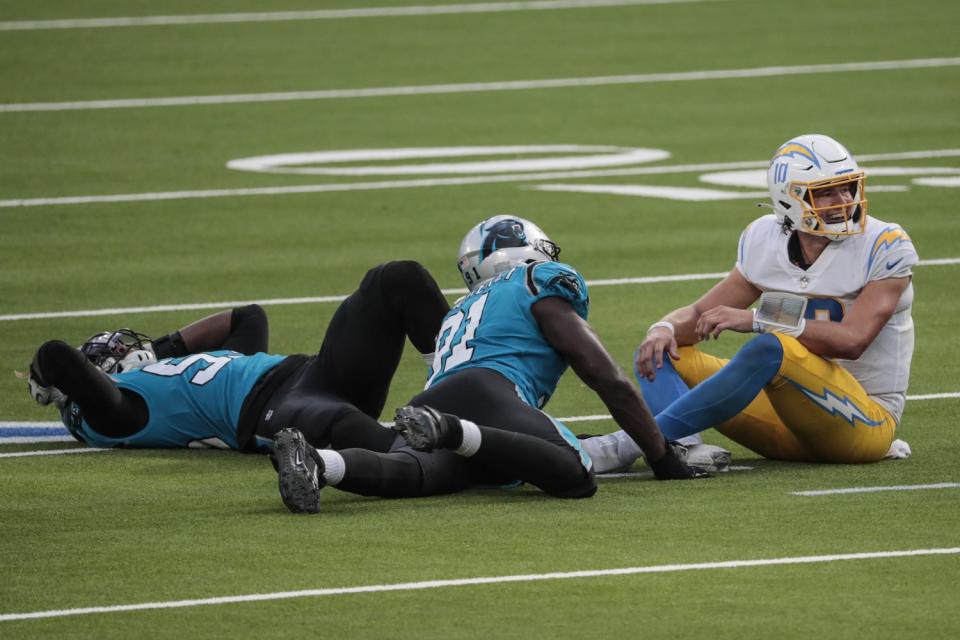 Chargers Justin Herbert (10) watches the failed last second trick play against the Panthers.