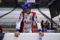 Tony Kanaan, of Brazil, looks down the pit lane during practice for the Indianapolis 500 auto race at Indianapolis Motor Speedway in Indianapolis, Friday, Aug. 14, 2020. (AP Photo/Michael Conroy)