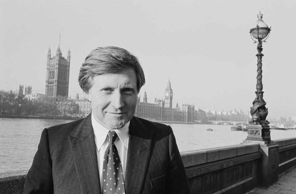 British journalist and broadcaster David Dimbleby in London, with the Palace of Westminster across the Thames in the background, circa 1983. (Photo by Tim Roney/Getty Images)