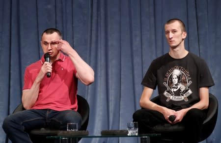 Ukrainian filmmaker Oleg Sentsov and activist Oleksandr Kolchenko attend a news conference in Kiev