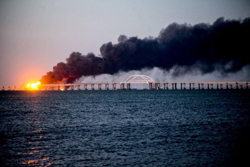 An explosion carried out by the Security Service of Ukraine (SBU) causes fire at the Kerch bridge in the Kerch Strait, Russian-occupied Crimea, on Oct. 8, 2022. (Vera Katkova/Anadolu Agency via Getty Images)
