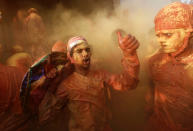 <p>Hindu devotees take part in the religious festival of Holi inside a temple in Nandgaon village, in the state of Uttar Pradesh, India Feb. 25, 2018. (Photo: Adnan Abidi/Reuters) </p>