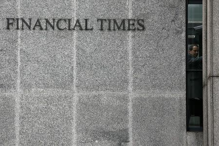 A man enters the headquarters of the Financial Times newspaper in London, Britain November 19, 2015. REUTERS/Stefan Wermuth