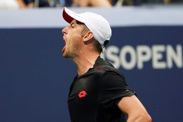 Giant killer: Australia's John Millman celebrates a point on the way to victory over 20-time Grand Slam Roger Federer in the fourth round of the US Open on Monday