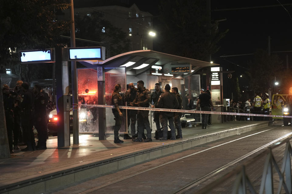 Israeli Border Police work at a crime scene at a light rail train station after a stabbing in Jerusalem, Wednesday, Aug. 30, 2023. Israeli police said a Palestinian assailant stabbed an Israeli man near a light-rail station before the attacker was shot and killed by police. Israeli paramedics said the Israeli man was moderately wounded, and pronounced the attacker dead. (AP Photo/Mahmoud Illean)