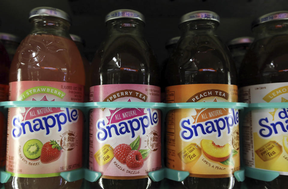 FILE - This April 28, 2016, file photo shows bottles of Snapple in a cooler at Quality Cash Market in Concord, N.H. On Friday, May 14, The Associated Press reported on stories circulating online incorrectly claiming the underside of a Snapple lid shows the company included, “Trump lost and the election was not stolen,” as a “Real Fact” the company prints on its beverage lids. (AP Photo/Jim Cole, File)