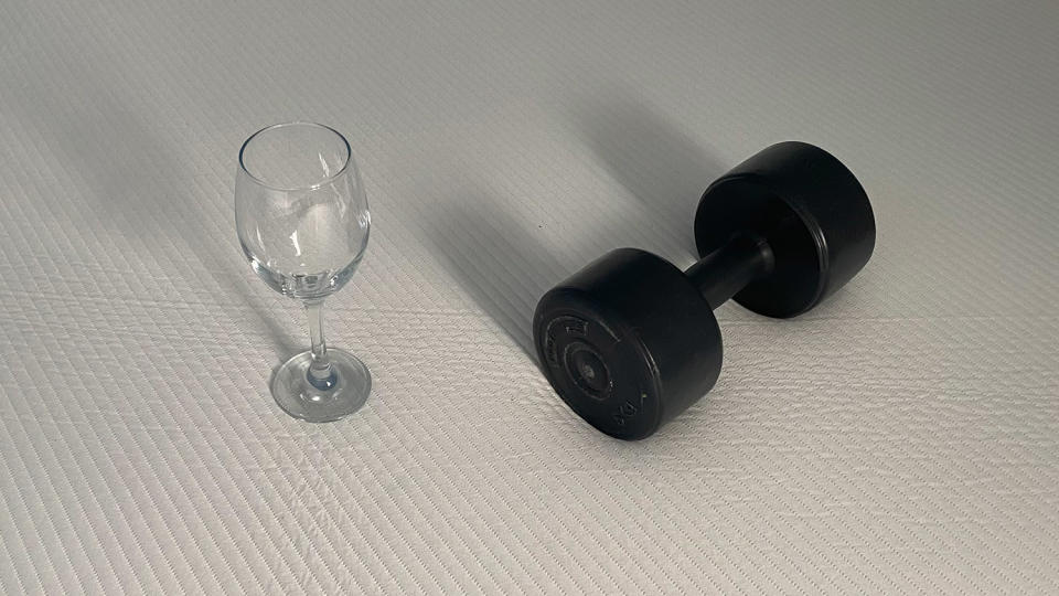 A weight and a wine glass on the Hypnia Supreme Memory Mattress