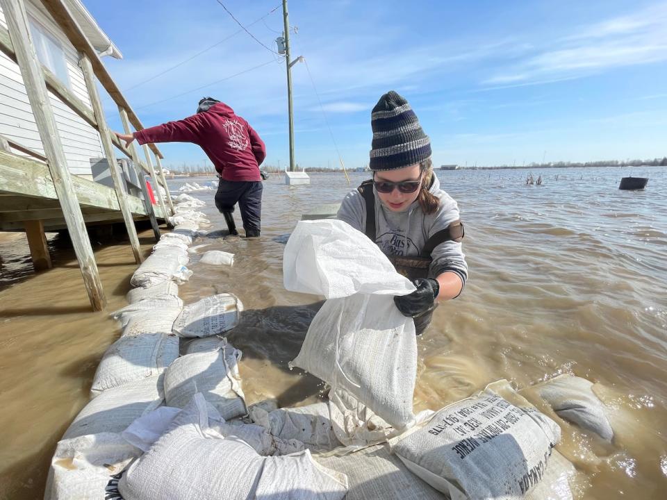 Sandbagging home on the Peguis First Nation on May 6, 2022. The Fisher River has spilled its banks at Peguis, flooding a broad area of Manitoba's low-lying northern Interlake region. 