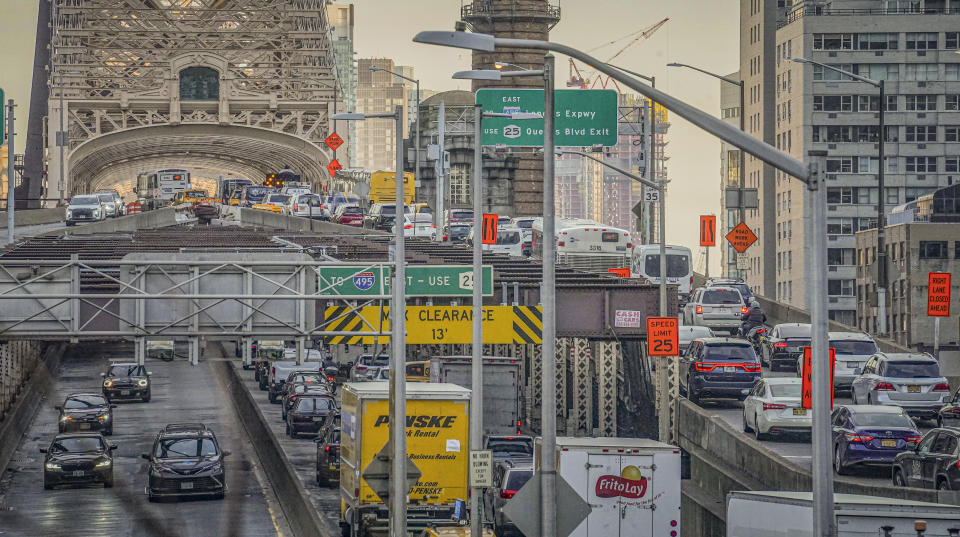 Traffic enter and leave mid-town Manhattan via the Queensboro Bridge, Thursday, Feb. 8, 2024, in New York. The Big Apple is close to implementing a plan that would use license-plate readers to turn all of Manhattan south of Central Park into one giant toll zone. (AP Photo/Bebeto Matthews)