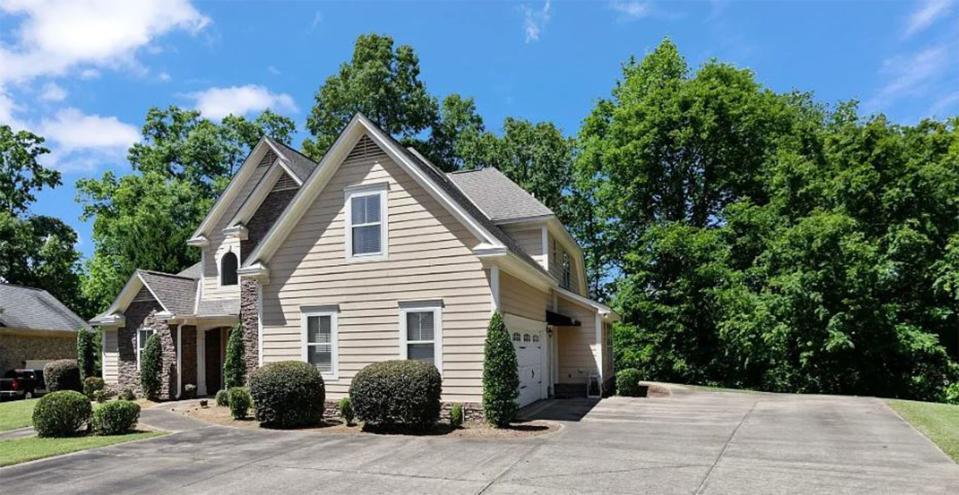 The two-story home for sale at 6329 Philadelphia Hill in Beauvoir includes four bedrooms and three and a half bathrooms within 3,017 square feet of living space. The property is on the market for $449,900.