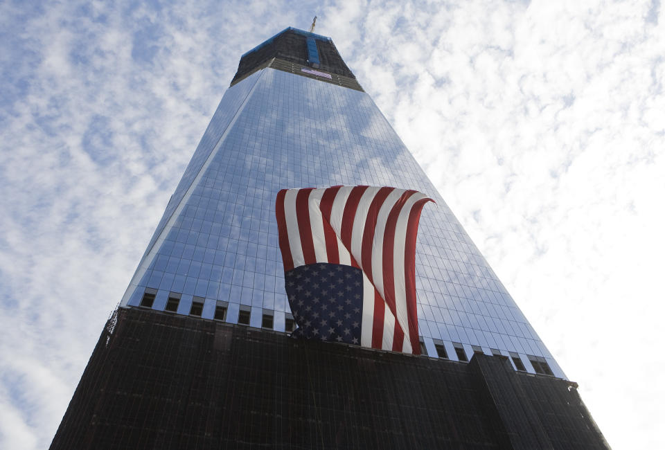 NEW YORK, NY - SEPTEMBER 11: The Freedom Tower is seen during the tenth anniversary ceremonies of the September 11, 2001 terrorist attacks at the World Trade Center site, September 11, 2011 in New York City. New York City and the nation are commemorating the tenth anniversary of the terrorist attacks which resulted in the deaths of nearly 3,000 people after two hijacked planes crashed into the World Trade Center, one into the Pentagon in Arlington, Virginia and one crash landed in Shanksville, Pennsylvania. (Photo by Kristoffer Tripplaar-Pool/Getty Images)