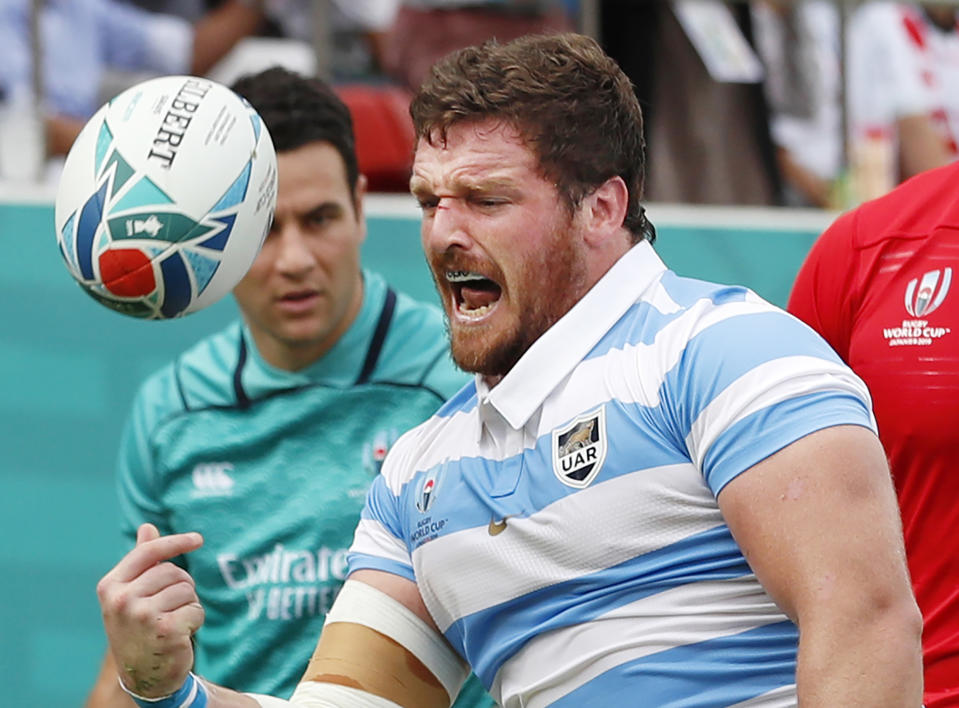 Argentina's Julian Montoya celebrates after scoring his team's first try during the Rugby World Cup Pool C game at Hanazono Rugby Stadium between Tonga and Argentina in Osaka, Japan, Saturday, Sept. 28, 2019 (Kyodo News via AP)