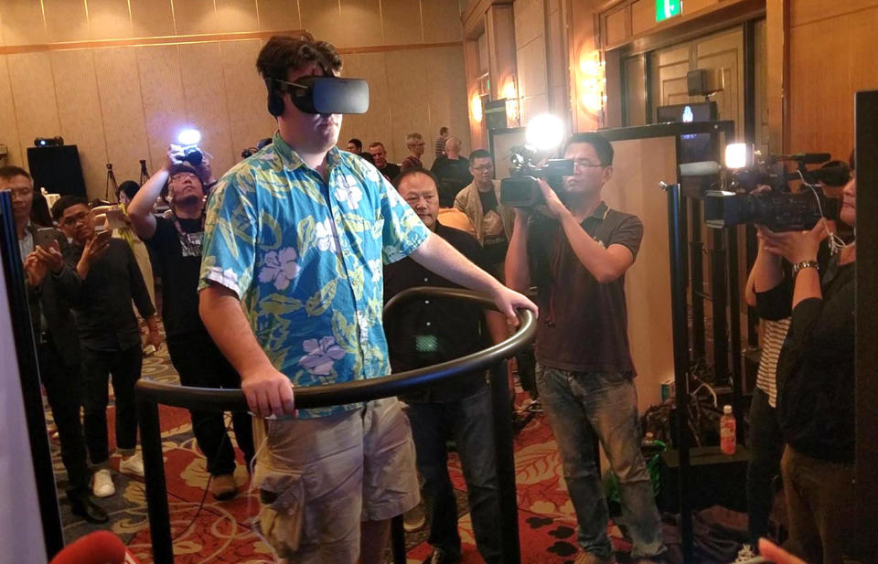 Oculus founder Palmer Luckey tries Futuretown 5D Totalmotion platform at the Tokyo Game Show.