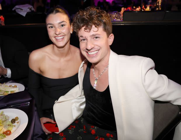 <p>Johnny Nunez/Getty</p> Brooke Sansone and Charlie Puth in 2023