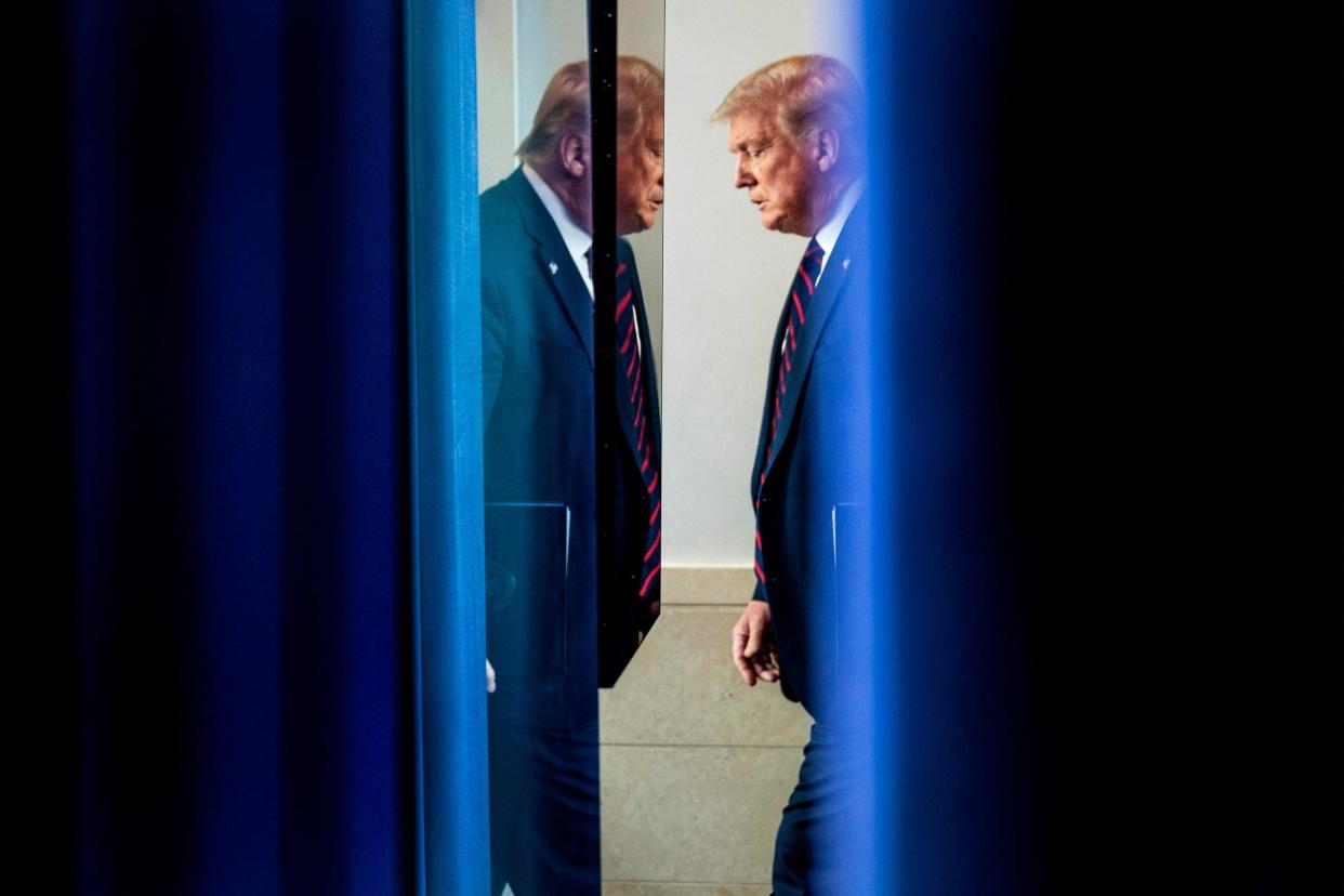 Donald Trump arrives at his press briefing after suggesting the election be delayed: AFP via Getty Images