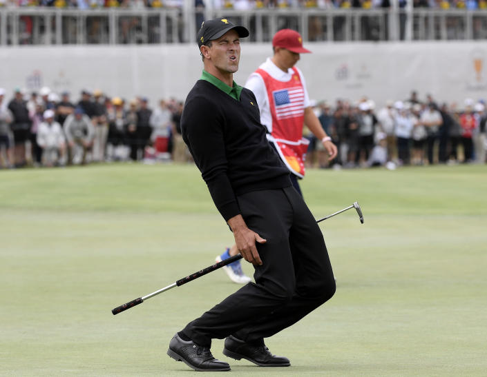 FILE - International team player Adam Scott of Australia grimaces after missing a putt on the 16th green in his singles match during the Presidents Cup golf tournament at Royal Melbourne Golf Club in Melbourne, Sunday, Dec. 15, 2019. The last Presidents Cup was so close the International team walked away with renewed hope that it had enough game and enough fight to conquer the mighty Americans. (AP Photo/Andy Brownbill, File)