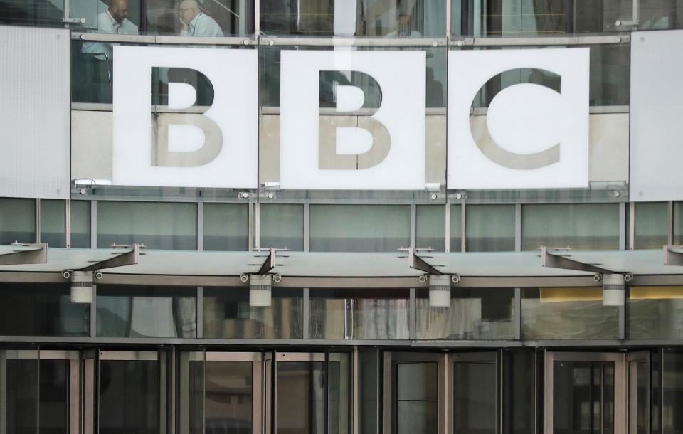 FILE - This photo shows a BBC sign outside the entrance to the headquarters of the publicly funded media organization in London, July 19, 2017. Officials from India's Income Tax department began conducting searches Tuesday, Feb. 14, 2023, at the BBC's offices in the capital, New Delhi, weeks after the British broadcaster released a controversial documentary that examined Prime Minister Narendra Modi's role during 2002 anti-Muslim riots. (AP Photo/Frank Augstein, File)