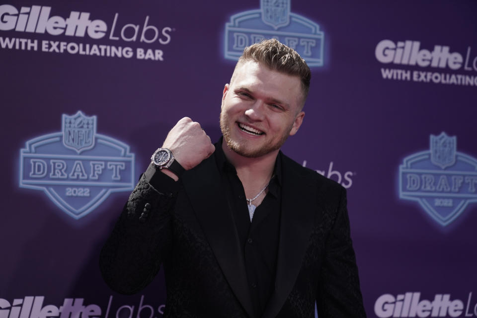 Michigan defensive end Aidan Hutchinson poses on the red carpet before the first round of the NFL football draft Thursday, April 28, 2022, in Las Vegas. (AP Photo/Jae C. Hong )