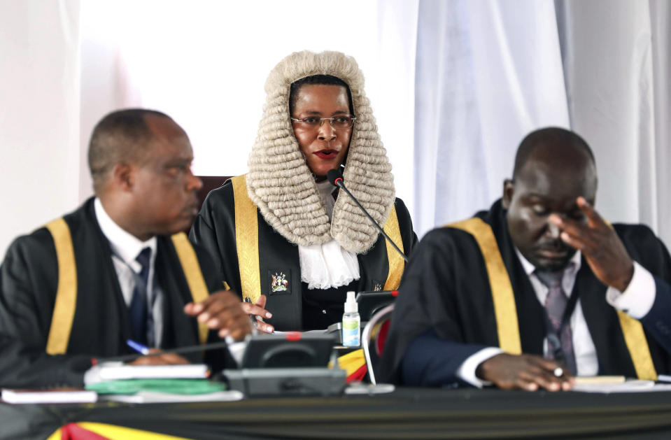 FILE - Speaker of the Parliament of Uganda Anita Among, centre, speaks during a 'State of the Nation' address at Kololo independence grounds in Kampala, Uganda, Wednesday, Feb 14, 2024. The United States on Thursday imposed sanctions on Uganda's parliamentary speaker and other officials over alleged corruption and serious abuses of human rights. Speaker Anita Among has been sanctioned "due to involvement in significant corruption tied to her leadership" of the national assembly, a State Department statement said. (AP Photo/Hajarah Nalwadda, File)