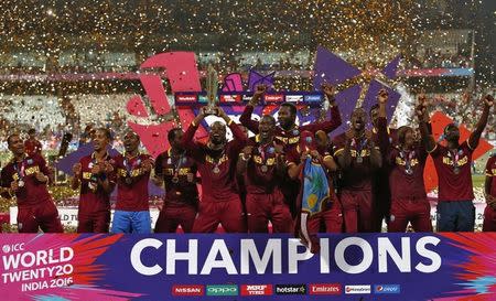 West Indies players celebrate with the trophy after winning the final. Cricket - England v West Indies - World Twenty20 cricket tournament final - Kolkata, India - 03/04/2016. REUTERS/Adnan Abidi